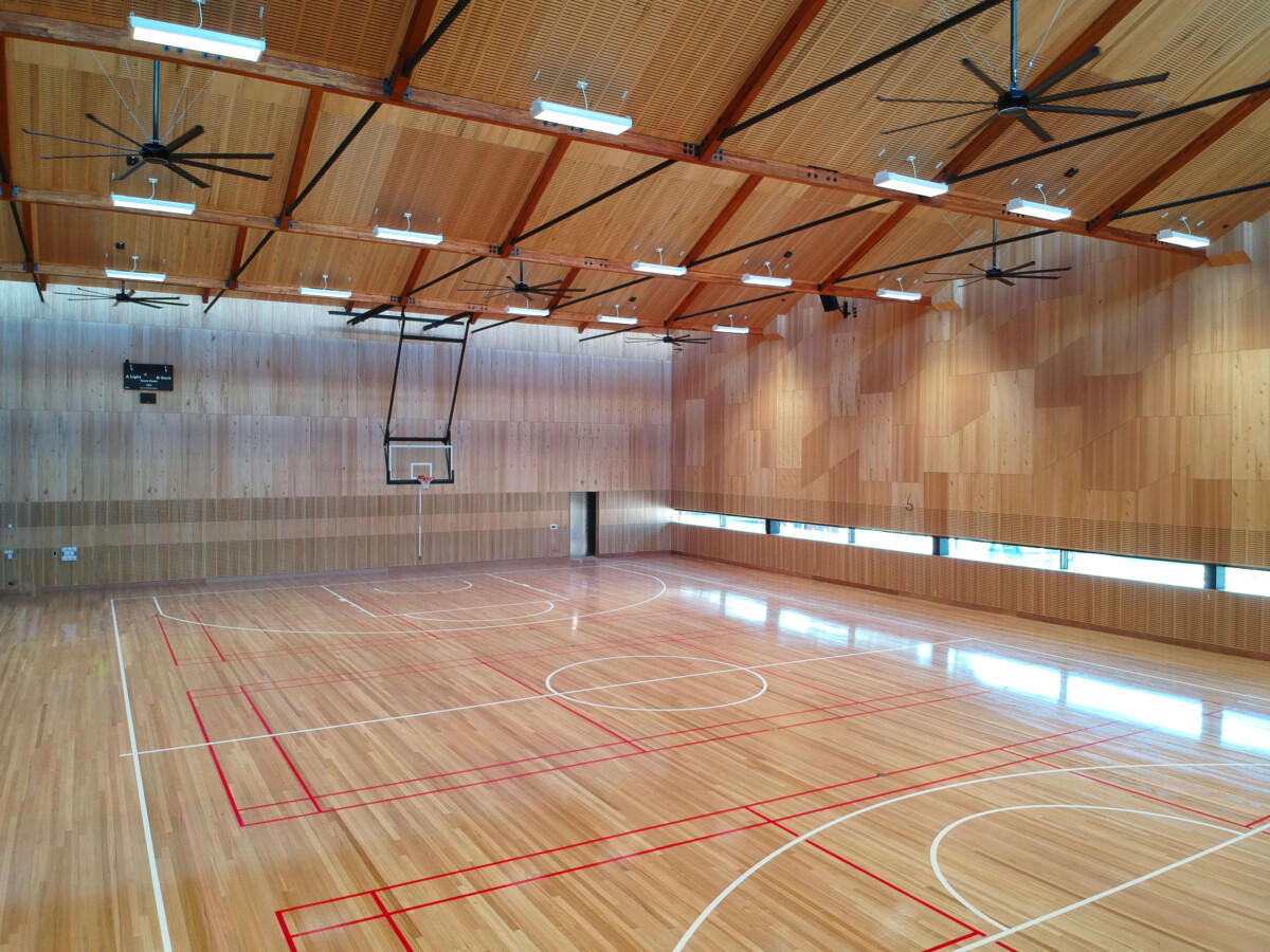 Wooden basketball court with Mass Timber beams