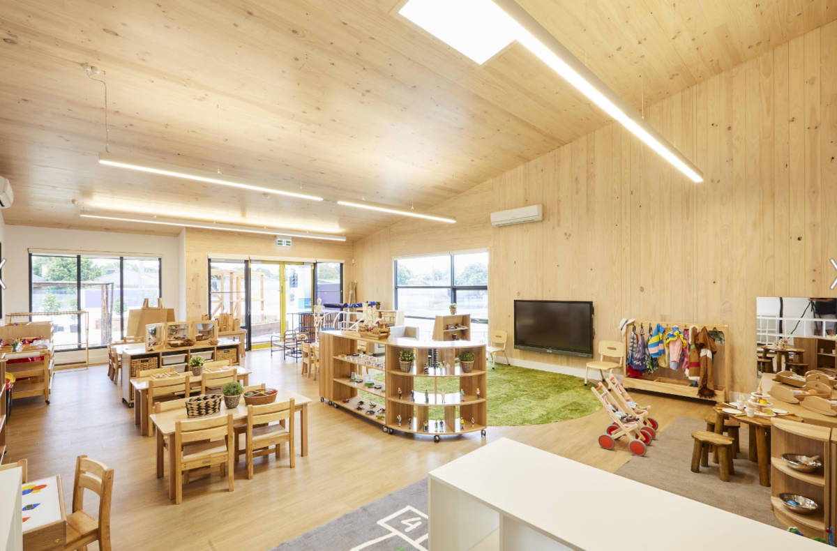 A childrens' classroom and play area with exposed CLT and Mass Timber floor, walls and ceiling at Oakleigh Childcare Centre